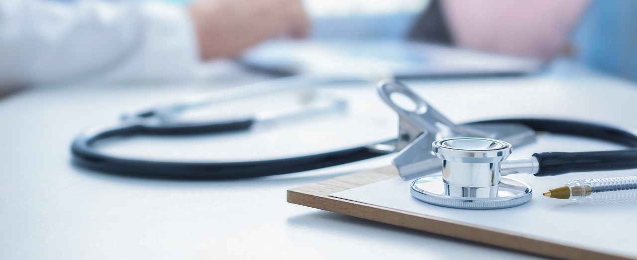 Remove Stethoscope and clip board on the doctor workplace close up