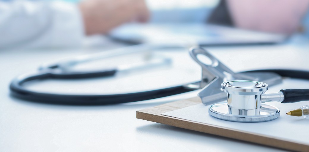 Remove Stethoscope and clip board on the doctor workplace close up