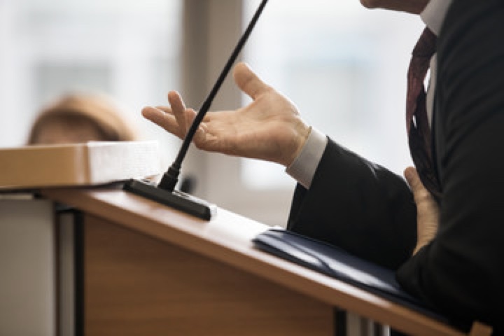 Judge speaking into a microphone